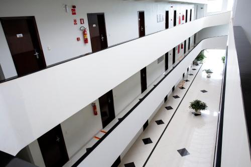 an empty hallway in an office building at Tezla Hotel in Primavera do Leste