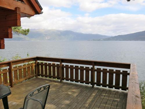 a deck with chairs and a view of the water at Holiday Home Maria - FJS114 by Interhome in Balestrand