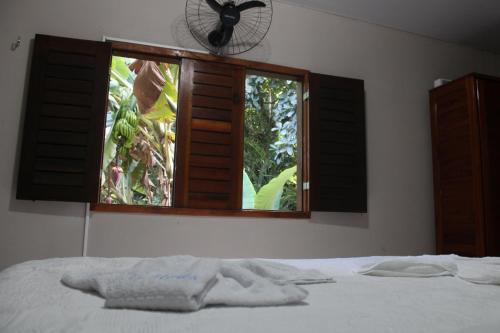 Katil atau katil-katil dalam bilik di HOTEL CANTINHO DAS FLORES
