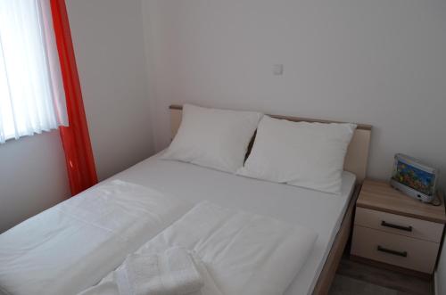 Un ou plusieurs lits dans un hébergement de l'établissement Apartments Sušec