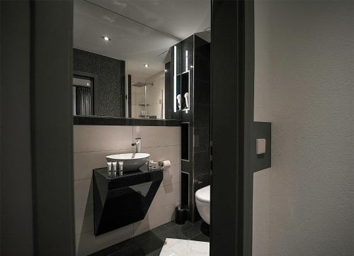 Koupelna v ubytování Hotel Royal