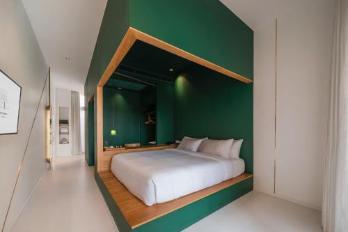 Ένα ή περισσότερα κρεβάτια σε δωμάτιο στο Baan Pomphet