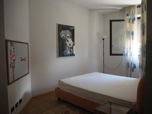 Appartamento sul Mare tesisinde bir odada yatak veya yataklar