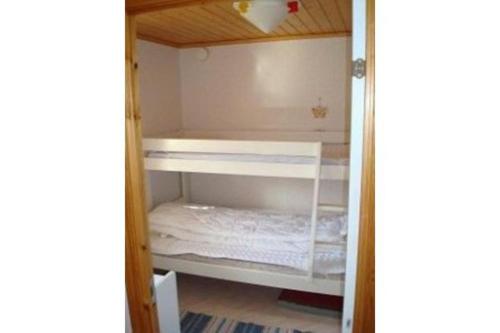 otwarte drzwi szafy z białą półką w obiekcie By the Baltic sea, 2 bedrooms w mieście Karlskrona