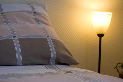 Кровать или кровати в номере Ensche-Day Inn