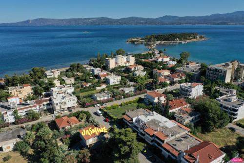 an aerial view of a city next to the water at jasmine apartments in Eretria