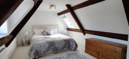 a attic bedroom with a bed and a window at Market View in Berkeley