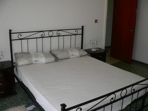 מיטה או מיטות בחדר ב-GP casa vacanza Amantea