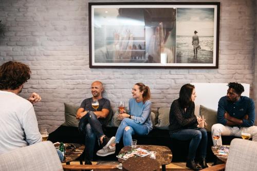 a group of people sitting on a couch at Monsieur Maurice in Bruges
