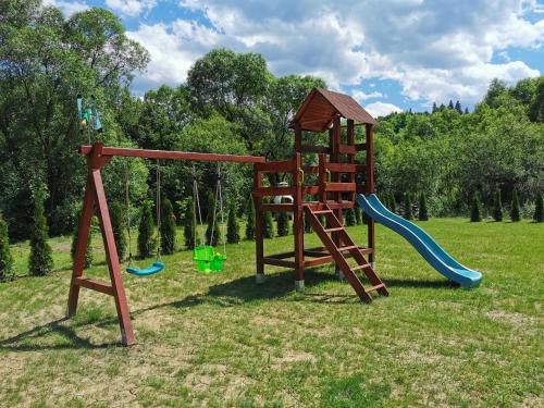 a playground with a slide and a slideintend at Zamoček in Matiašovce