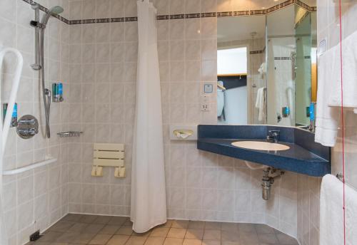 a bathroom with a sink and a shower at Holiday Inn Express Swindon West by IHG in Swindon