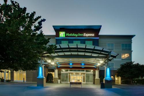 a building with a sign that reads hacienda inn express at Holiday Inn Express Georgetown by IHG in Georgetown