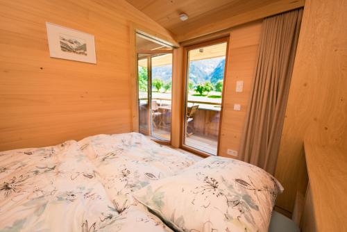 A bed or beds in a room at Apartments Bergleben Goldegg