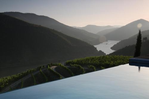 a view of a valley with a river and mountains at CASA da PISCINA, Quinta do Espinho, Douro Valley in Tabuaço