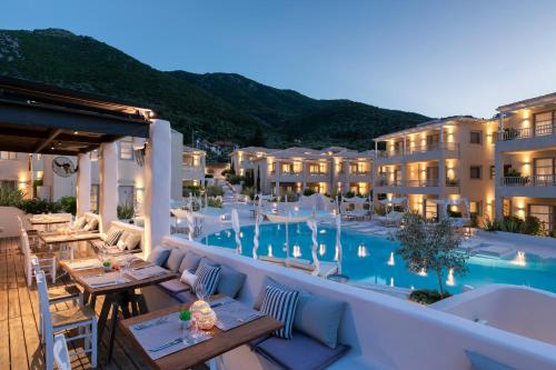 a view of a hotel with a swimming pool at Crystal Waters in Nikiana