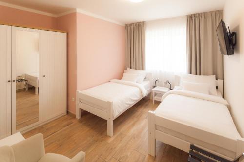 a hospital room with two beds and a mirror at Golf Čertovo břemeno in Jistebnice