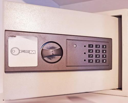 a microwave oven with a button on the side at Pearl Stone Apartments in Šibenik