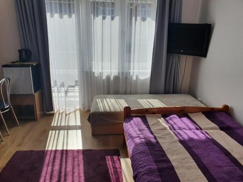 Cama ou camas em um quarto em Kwatery u Sylwii - Apartament i pokoje