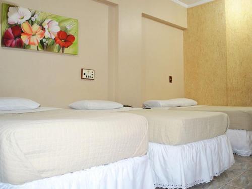 Cama o camas de una habitación en Perea Hotel
