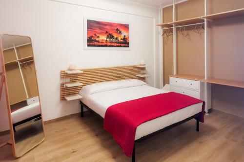 A bed or beds in a room at Elite Residence Mondello