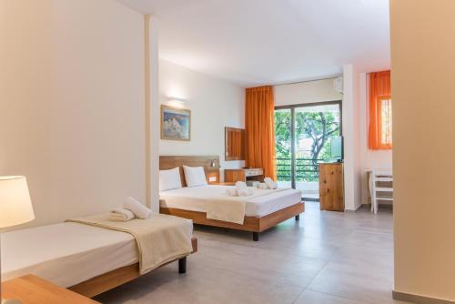 Postel nebo postele na pokoji v ubytování Lido Hotel