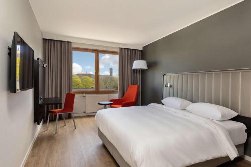 Postel nebo postele na pokoji v ubytování Park Inn by Radisson Meriton Conference & Spa Hotel Tallinn