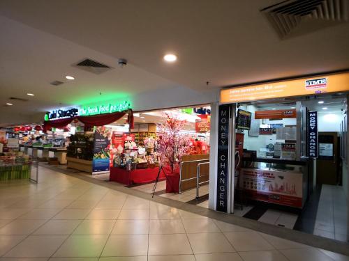 a store in a shopping mall with a grocery store at The Landmark by Comfy in George Town