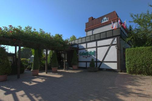 a building with a sign on the side of it at Hotel-Restaurant Esbach Hof in Kitzingen