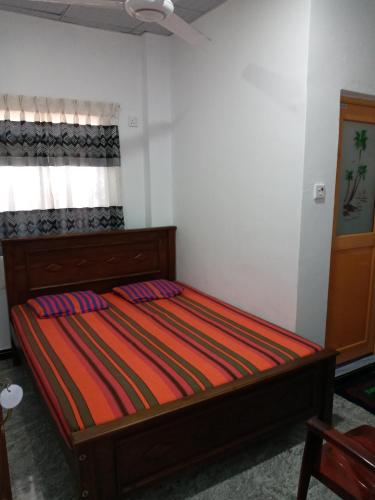 a bedroom with a bed in a room at David Villa in Anuradhapura