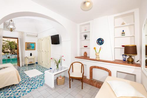 a living room with a bed and a table at Casa Guadagno in Positano