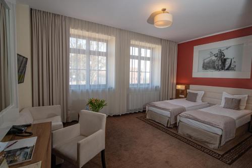 Postel nebo postele na pokoji v ubytování Hotel Zamek Gniew