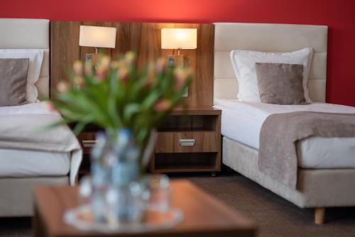 Postel nebo postele na pokoji v ubytování Hotel Zamek Gniew
