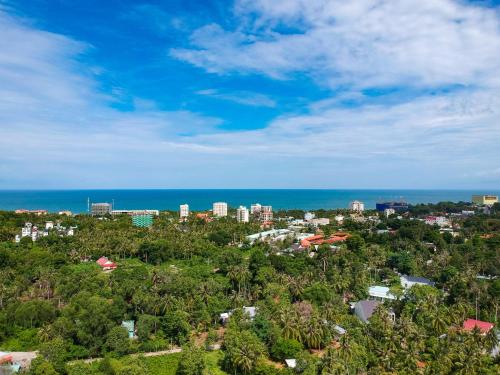 an aerial view of a city and the ocean at Casare Phu Quoc - Formerly Caesar Hotel in Phu Quoc