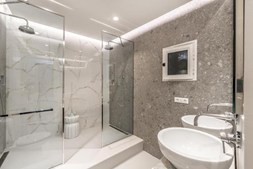 a bathroom with a glass shower and a sink at La Torretta Lodge in Manarola