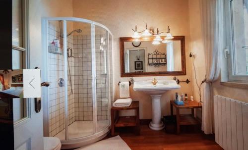 a bathroom with a sink and a shower at Peace of mind N 3 in Poljane