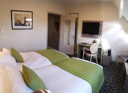 Ένα ή περισσότερα κρεβάτια σε δωμάτιο στο Hotel Le Cercle