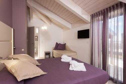 Postel nebo postele na pokoji v ubytování Hotel Gioia