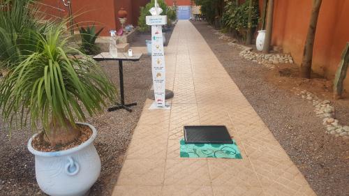 a briefcase sitting on a sidewalk next to a street at Hôtel Ajil Cascades D'ouzoud in Ouzoud