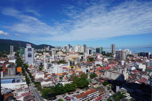 a view of a city with a lot of buildings at The Granite Luxury Hotel Penang in George Town