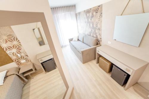 a view of a living room with a couch at All'Orologio - Boutique Hotel in Caorle