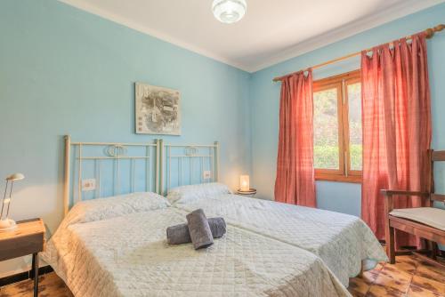 Ένα ή περισσότερα κρεβάτια σε δωμάτιο στο Villa Es Pinar