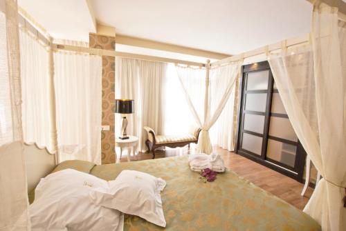 Postel nebo postele na pokoji v ubytování Hotel Centro Los Braseros