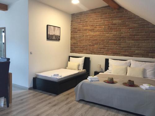 Ένα ή περισσότερα κρεβάτια σε δωμάτιο στο Penzion Lednice