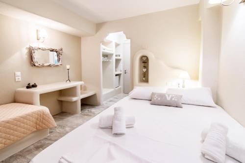 Ένα ή περισσότερα κρεβάτια σε δωμάτιο στο Fratelli Rooms