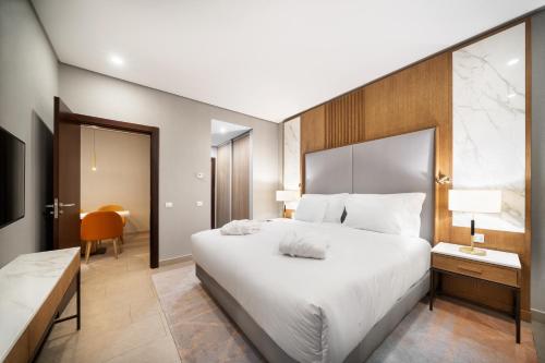 En eller flere senge i et værelse på Wyndham Grand Algarve