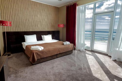 Ένα ή περισσότερα κρεβάτια σε δωμάτιο στο Stella Residence Club