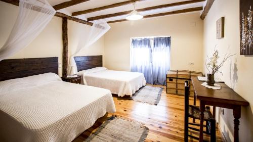 A bed or beds in a room at La Casa de la Estación