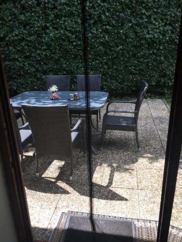 a table and chairs sitting on a patio at Haus zur Sonne in Bad Bertrich