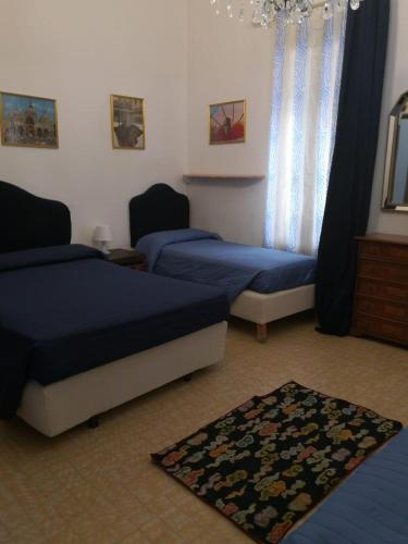 Postel nebo postele na pokoji v ubytování Alloggi alla Scala del Bovolo