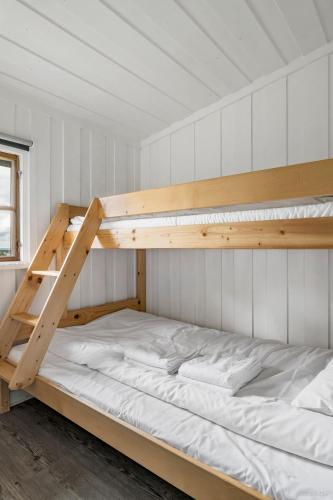 a bedroom with two bunk beds in a room at First Camp Frösön-Östersund in Frösö